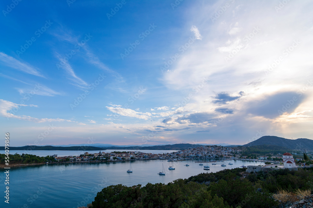 Beautiful view of Ermioni sea lagoon with moored yachts and boats at sunset time. Beautiful view of Ermioni sea lagoon with moored yachts and boats at sunset time.