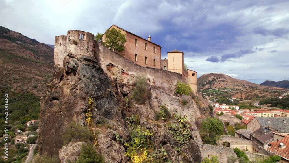 Corsica travel and landmarks. aerial drone video of medieval Corte town- mountain village in the central part of the island Corsica travel and landmarks. aerial drone video of medieval Corte town- mountain village in the central part of the island