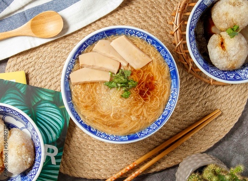 Abalone Mee Sua noodles with chopsticks and spoon served in bowl isolated on table top view of chinese food photo