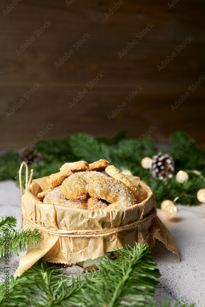 Traditional Christmas German and Australian vanilla crescent cookies packed in a cookie box. Place for text. Holiday baking concept