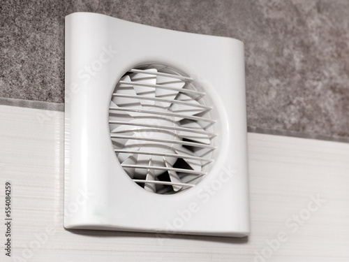 The fan is built into the wall in the bathroom, toilet or kitchen