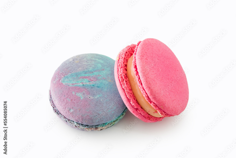 Sweet colorful macarons isolated on white background. Tasty colourful macaroons. Two multi-colored blue and pink macaroons. French pastry made from egg whites. Sweet colorful macarons isolated on white background. Tasty colourful macaroons. Two multi-colored blue and pink macaroons. French pastry made from egg whites.