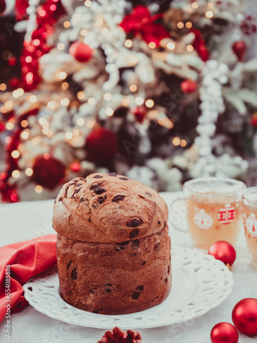 panetonne with tea and Christmas decoration on concrete background.