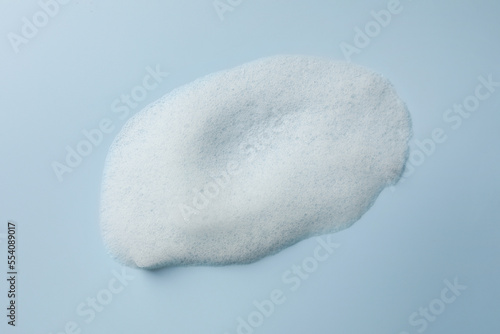 Foam sample on light blue background, top view