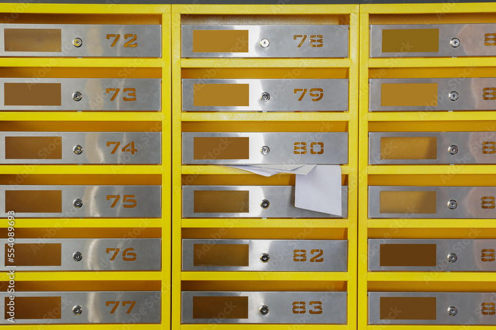 Metal mailboxes with receipts from post office indoors Metal mailboxes with receipts from post office indoors