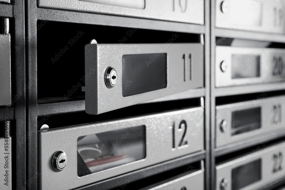 Open empty mailbox with keyhole and number, closeup Open empty mailbox with keyhole and number, closeup