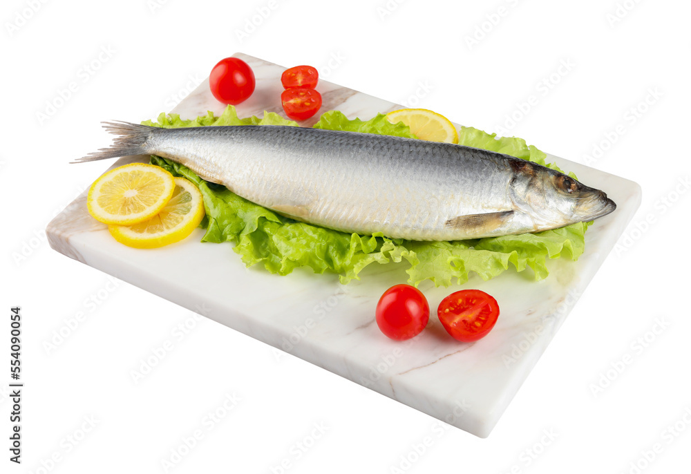 Board with salted herring, slices of lemon, lettuce and cherry tomatoes isolated on white Board with salted herring, slices of lemon, lettuce and cherry tomatoes isolated on white