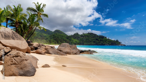 Seychelles Beach. Exotic tropical beach with beautiful rocks, palms and turquoise sea. 