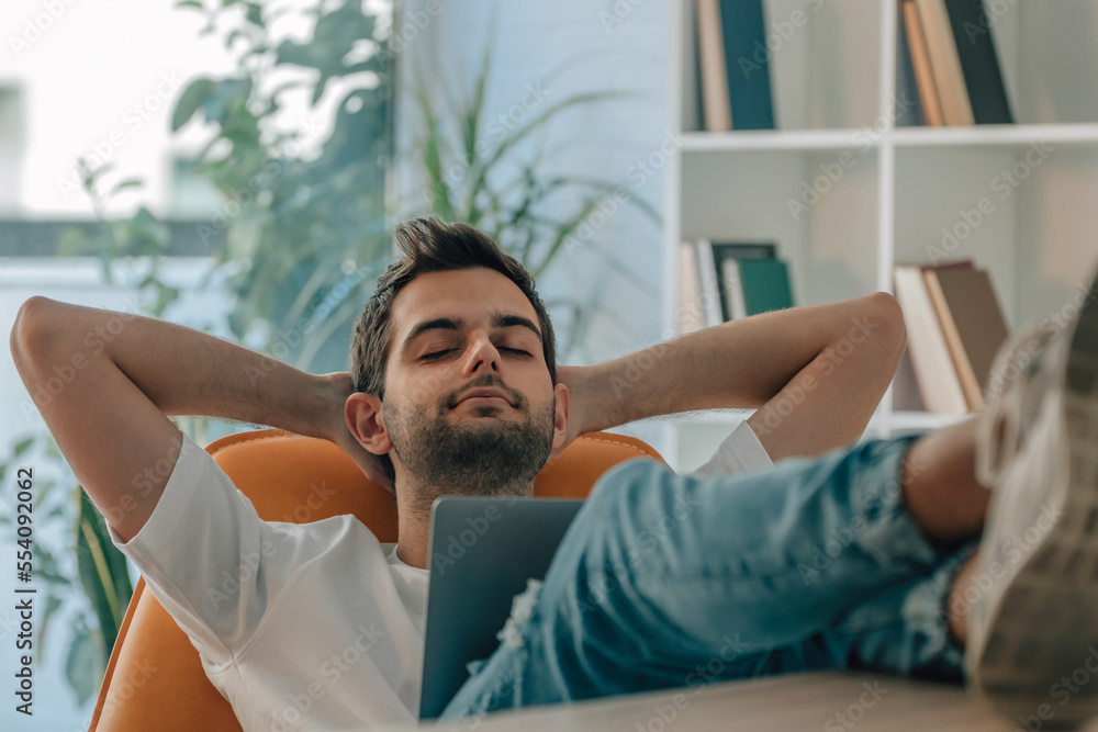 young man at home sleeping relaxed with computer young man at home sleeping relaxed with computer