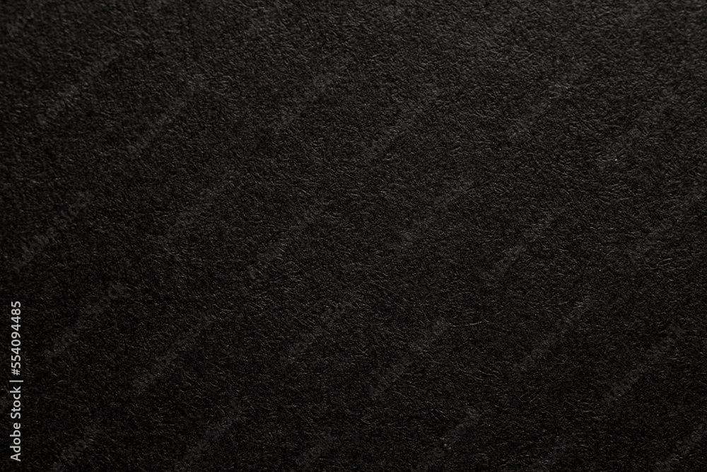 Black paper texture background. Black blank page. Background for your text. Macro photo.