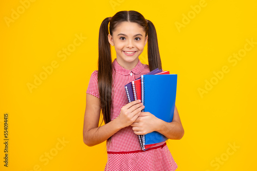 Back to school. Portrait of teenage school girl with books. Children school and education concept. Schoolgirl student. Happy teenager, positive and smiling emotions of teen girl.