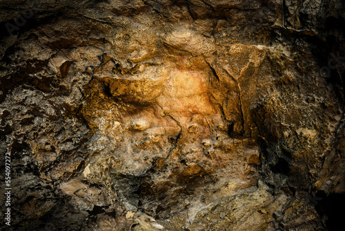 Ochre animal drawing on cave wall, Serpievskaya-2 (Kolokolnaya) cave, Ural Mountains, Russia photo