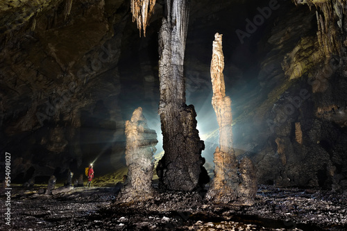 Large stalagmites in San Wang Dong create a spectacle mid way through a section of cave called Crusty Duvets.