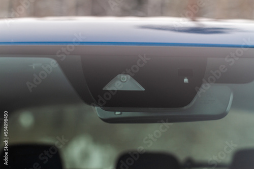 Windshield rain and light sensors of modern car. Car rain sensor.