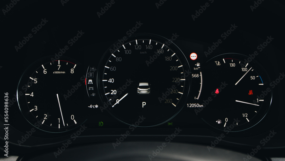 Fototapeta premium Close up shot with the digital car dashboard. Illuminated car dashboard.