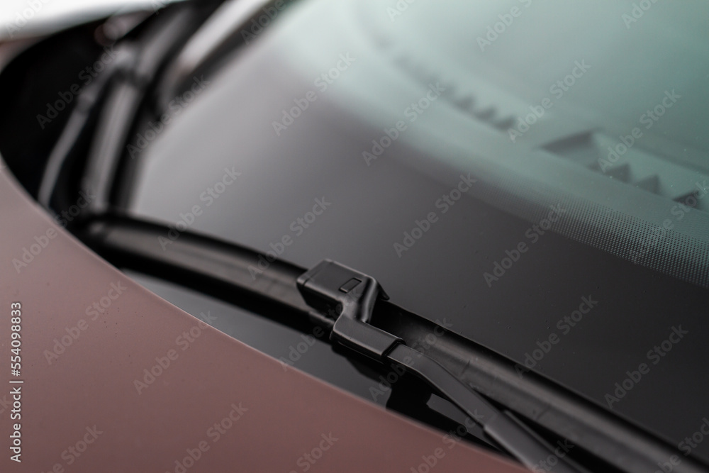 Car windwhield wiper close up. Modern car windshield wiper. Car windwhield wiper close up. Modern car windshield wiper.