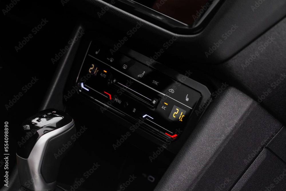 Fototapeta premium Car air conditioner dashboard. Modern car interior. Adjustable air conditioner. Car air conditioning system.