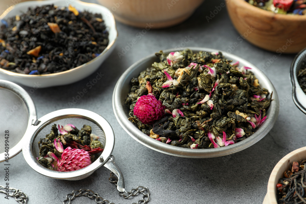 Many different herbal teas on grey table Many different herbal teas on grey table