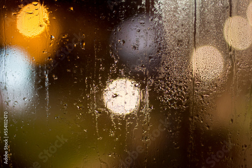 Misted window glass at night after rain
