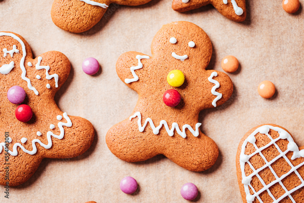 Various selection of Gingerbread cookies with sugar icing. Decorated in Christmas spirit. Happy New Year celebration. Playful and fun. 