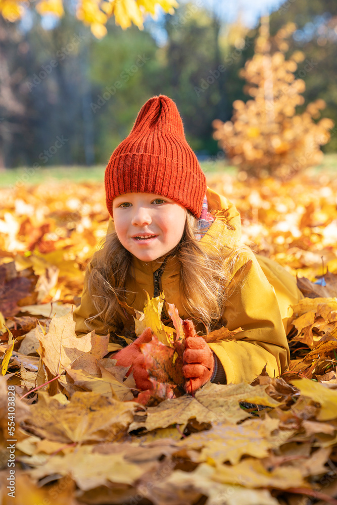 Beautiful little child girl in the autumn park. Happy child girl enjoying autumn Beautiful little child girl in the autumn park. Happy child girl enjoying autumn