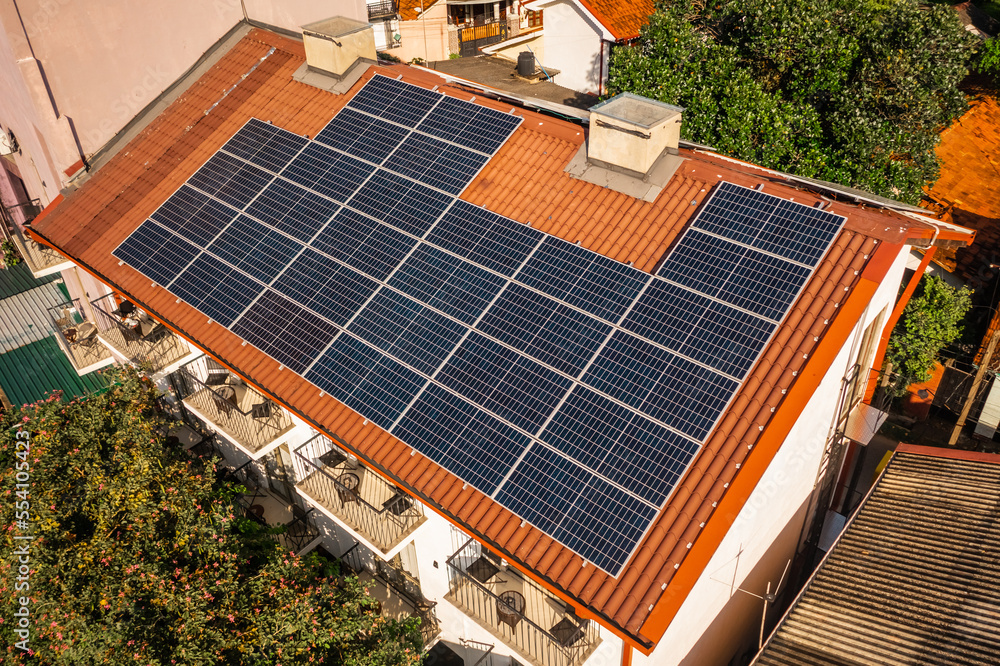 Solar panels on the roof of the house. Aerial view