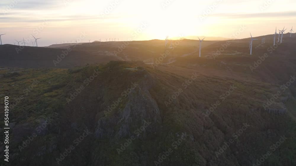 Epic drone flight over the Pica da Cana viewpoint in Madeira, Portugal. A wonderful sunset with several wind turbines in the background. Epic drone flight over the Pica da Cana viewpoint in Madeira, Portugal. A wonderful sunset with several wind turbines in the background.