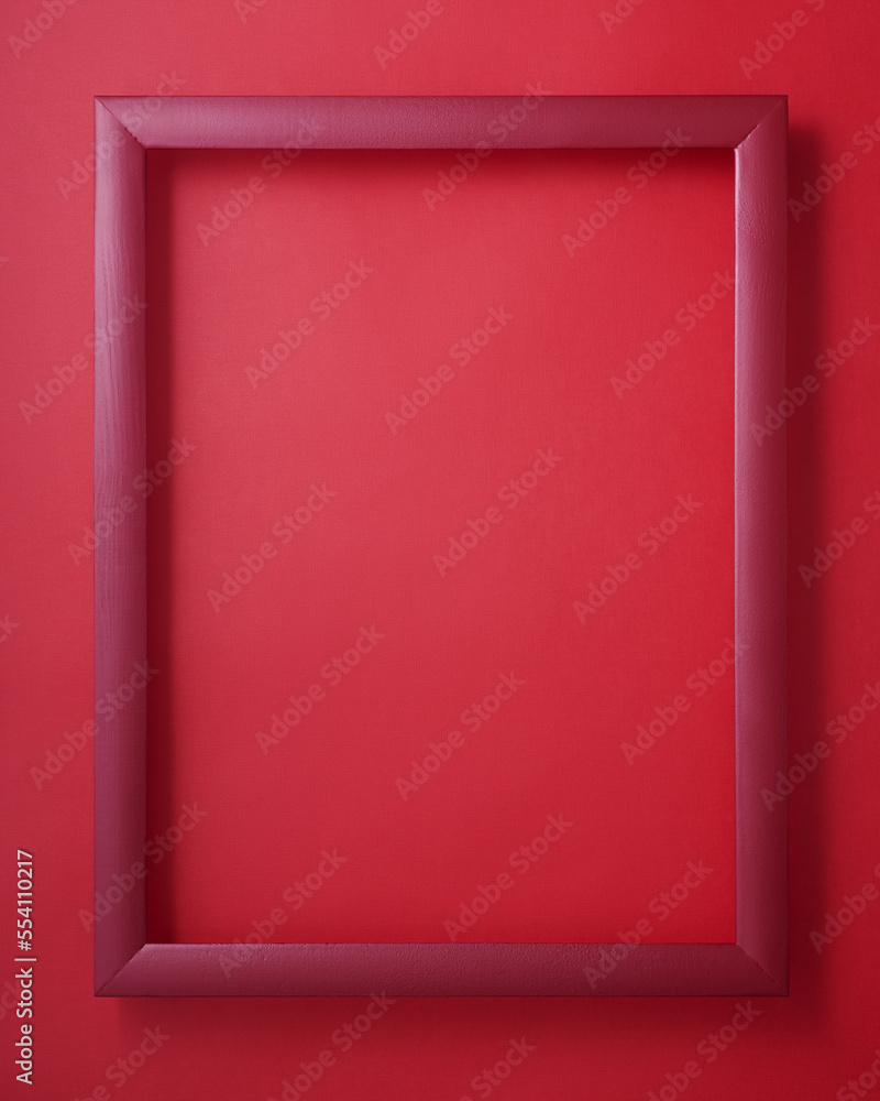 Red picture frame on red background Red picture frame on red background