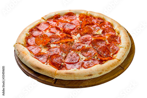 Pepperoni pizza on wooden board on concrete table