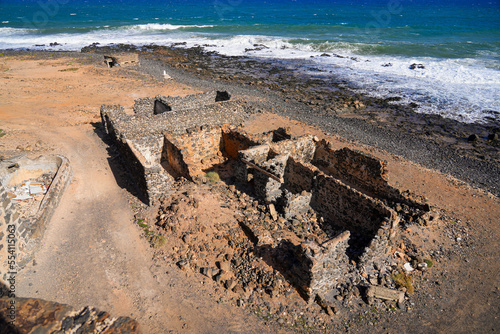 Abandoned ruins of the lime kilns of La Hondura, north of the capital city of Puerto del Rosario on Fuerteventura island in the Canaries, Spain - Crumbling ancient industrial building by the coast photo