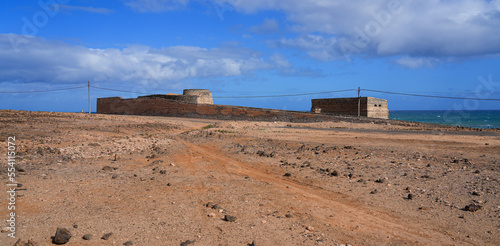 Abandoned ruins of the lime kilns of La Hondura, north of the capital city of Puerto del Rosario on Fuerteventura island in the Canaries, Spain - Crumbling ancient industrial building by the coast