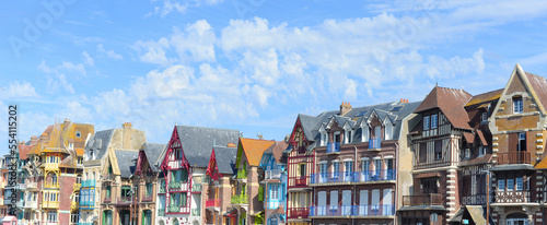 Panoramic view on typical colorful Belle Epoque houses in Art Nouveau style in the Quartier Balneair in Mers-les-Bains on the French coast in the Somme department on a summer afternoon