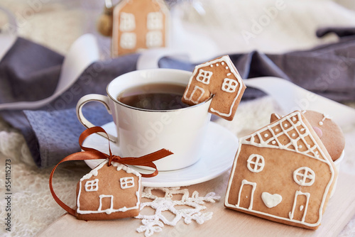 Aesthetic winter breakfast. Ginger cookies of cute homes and cup of coffee Cozy warm home