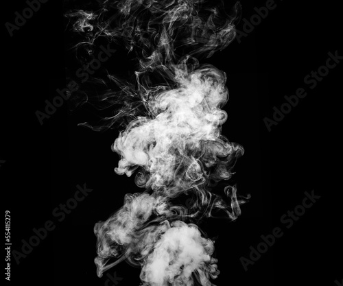 Abstract smoke texture over black background. Fog in the darkness.