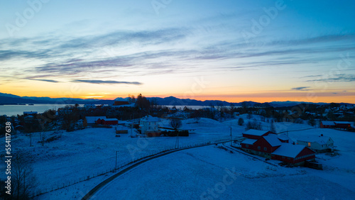 Sunset over the snow covered town center of Osøyro, Bjørnafjorden, Norway