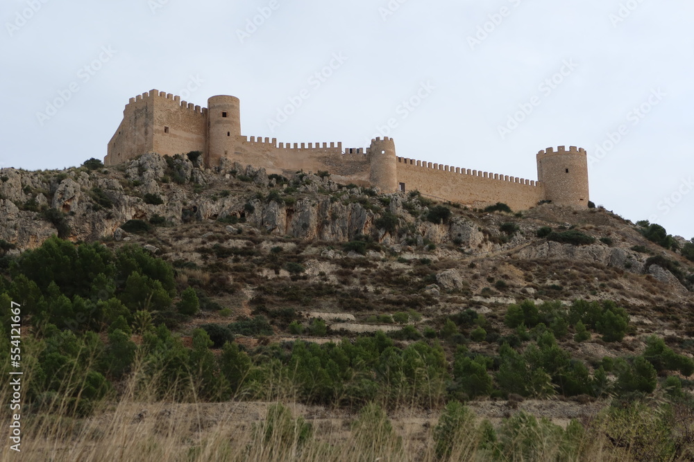 Castalla, Alicante, Spain, December 15. 2022: Towers and fortified walls of the castle of Castalla, Alicante. Spain
