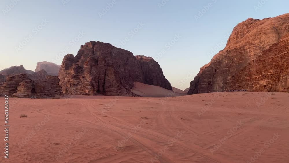 Groups of tourist on safari tour stop to watch sunset from viewpoint in Wadi Rum desert in Jordan Groups of tourist on safari tour stop to watch sunset from viewpoint in Wadi Rum desert in Jordan