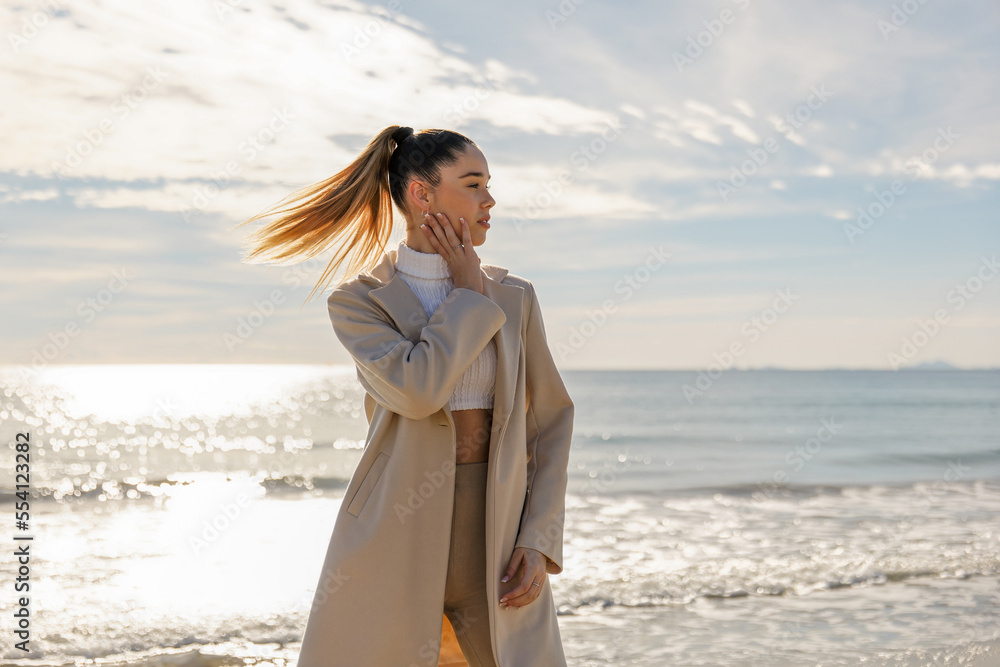 Portrait of a young pretty girl on the background of the sea Portrait of a young pretty girl on the background of the sea