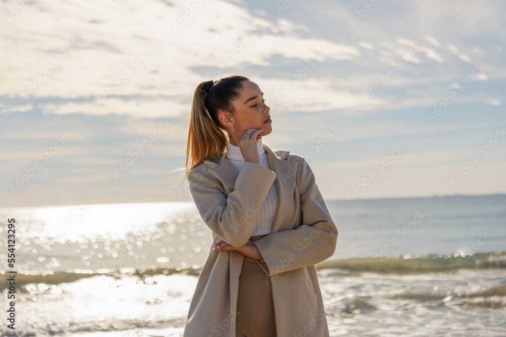 Portrait of a young pretty girl on the background of the sea Portrait of a young pretty girl on the background of the sea