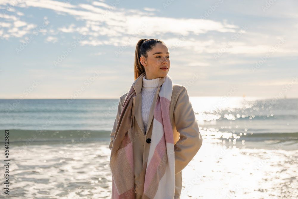 Portrait of a young pretty girl on the background of the sea Portrait of a young pretty girl on the background of the sea