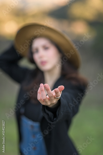 Blurred image of girl holding out her hand