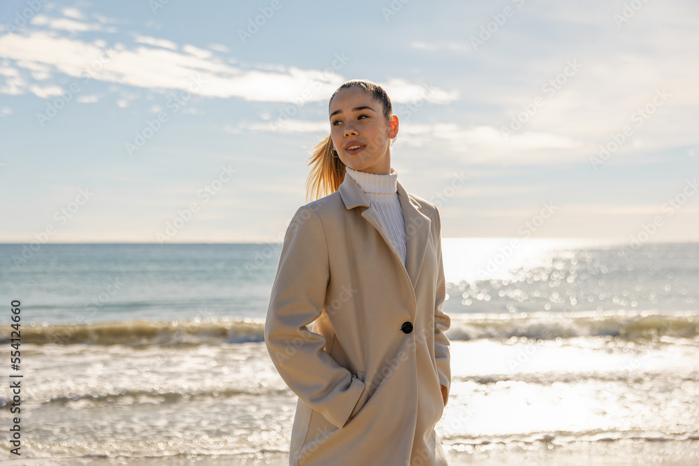 Portrait of a young pretty girl on the background of the sea Portrait of a young pretty girl on the background of the sea