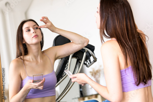 Girl applying makeup