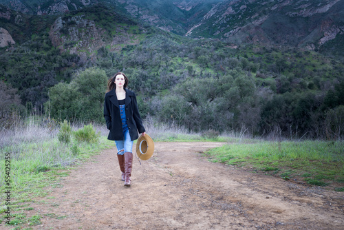 Country girl walking on a country road