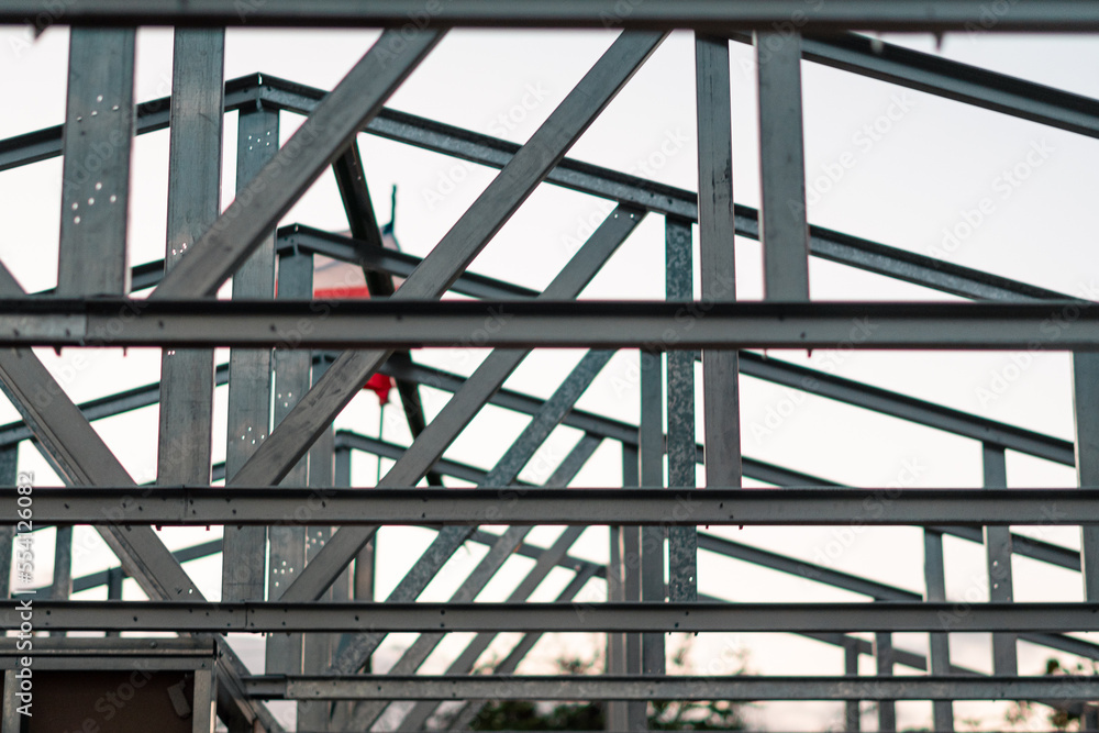 house under construction with structure of metal and iron