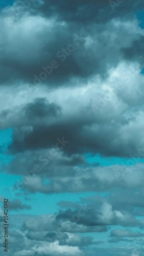 Timelapse of movement of dark blue night heavy clouds Vertical video