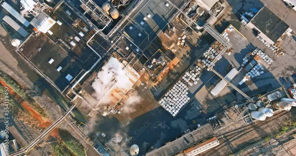 Aerial view an industrial area with materials and equipment being stored in tanks for chemical industry production Aerial view an industrial area with materials and equipment being stored in tanks for chemical industry production
