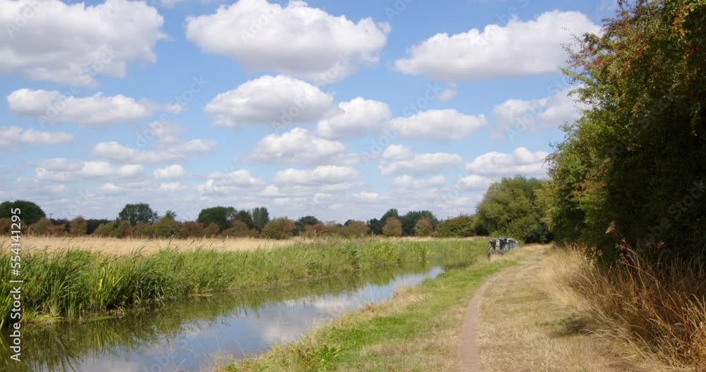 Wide Shot of British countryside with Trent and Mersey Canal on a sunny day Wide Shot of British countryside with Trent and Mersey Canal on a sunny day