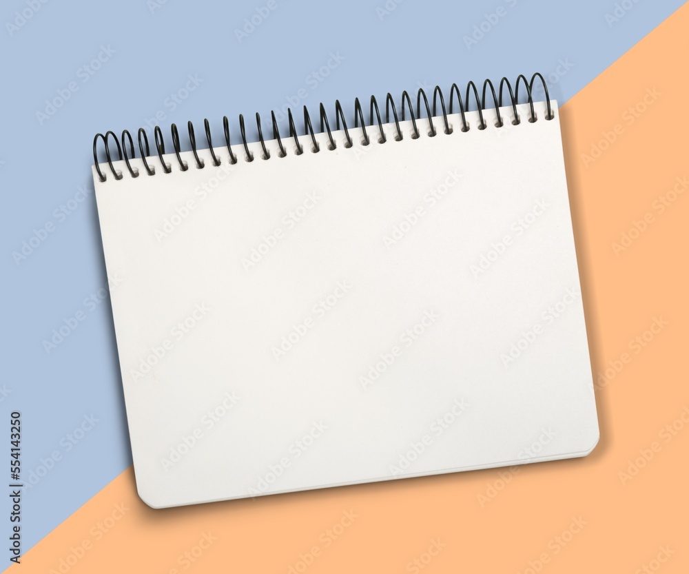 Blank desk office notebook on color background Blank desk office notebook on color background