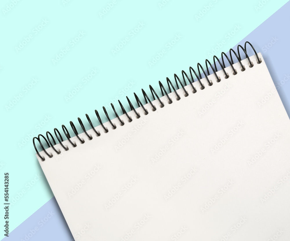 Blank desk office notebook on color background Blank desk office notebook on color background